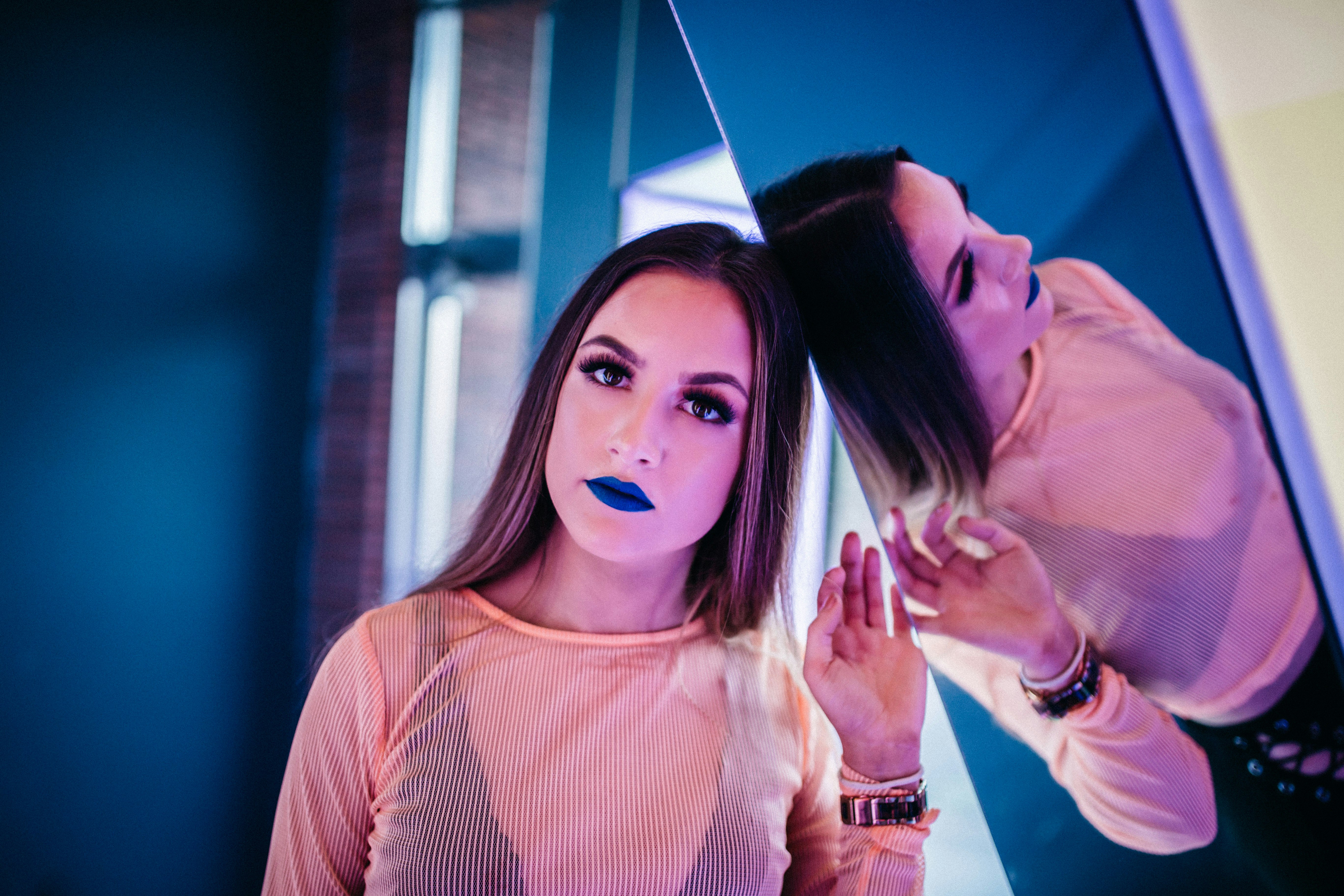 woman leaning on mirror